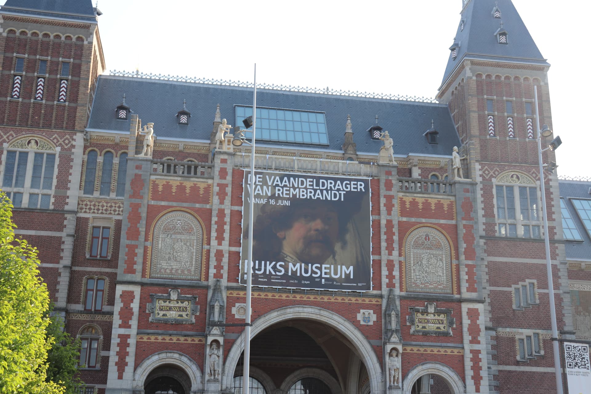 Outside of the Rijksmuseum with a banner depicting Rembrandt